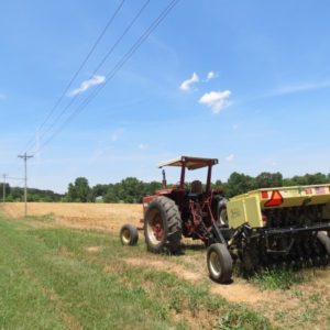 tractor pulling a drill planter
