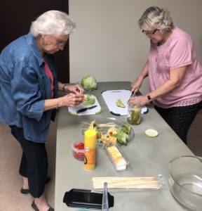 women preparing salad